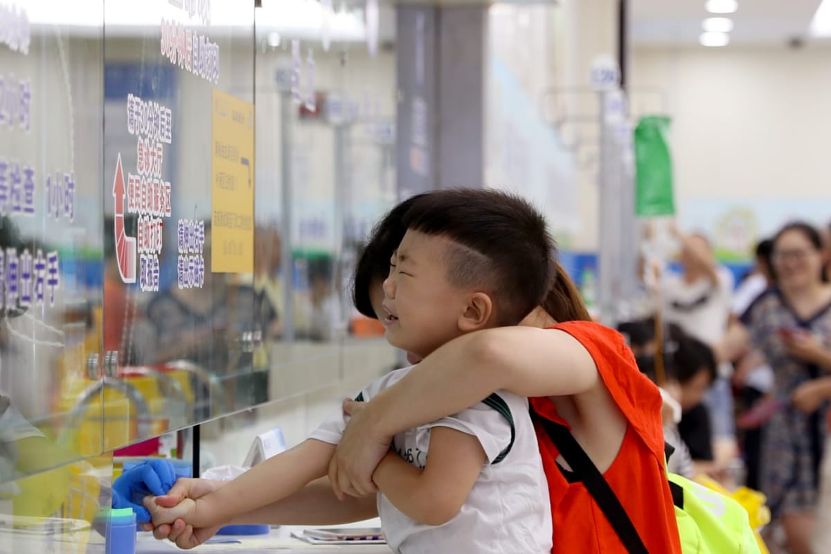 A boy has his blood sample collected at a children's hospital in Shanghai